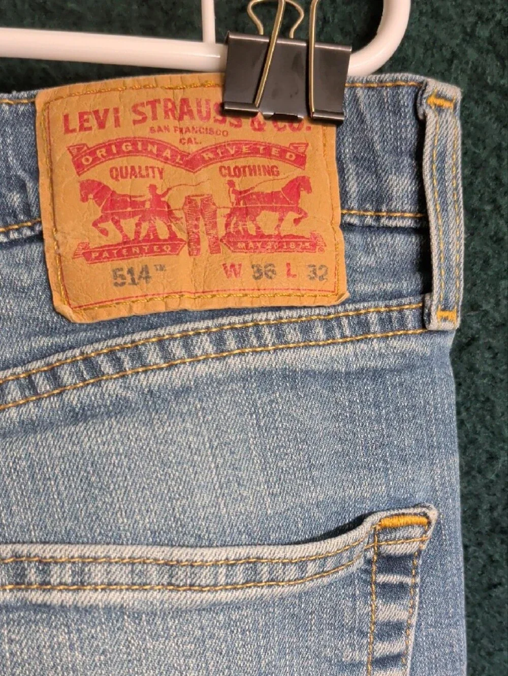 Levi's light blue denim jeans with tan leather patch